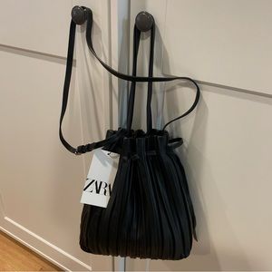 Zara drawstring bucket bag in black faux leather